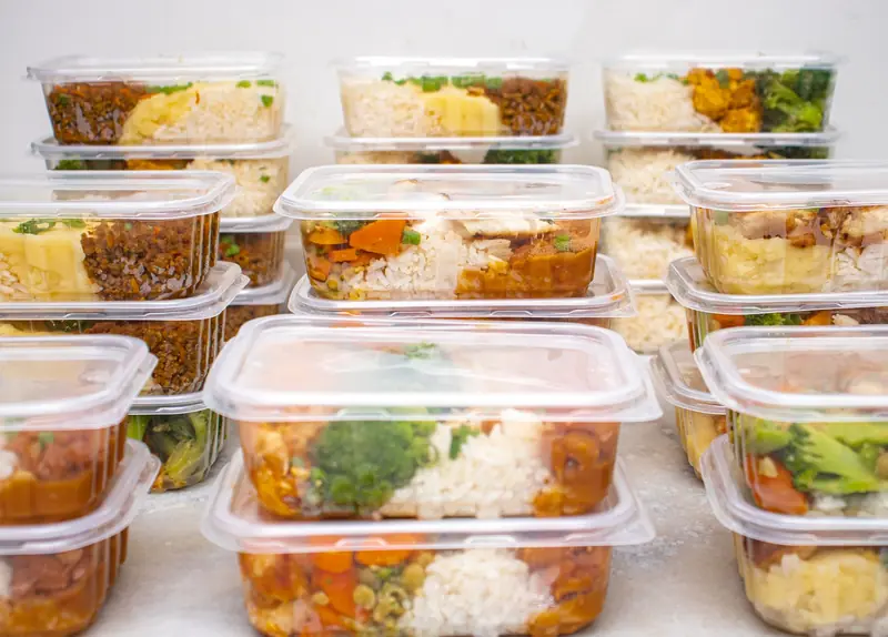 Multiple containers of prepared meals with rice and vegetables for easy meal management