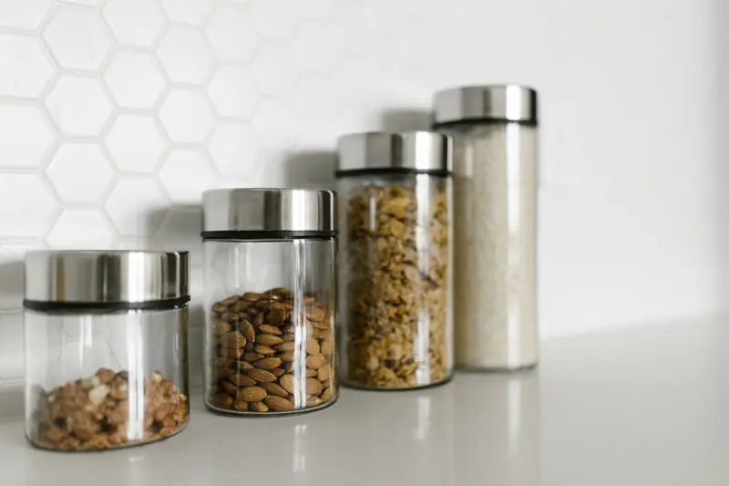 Stylish glass jars filled with food for a modern kitchen organization